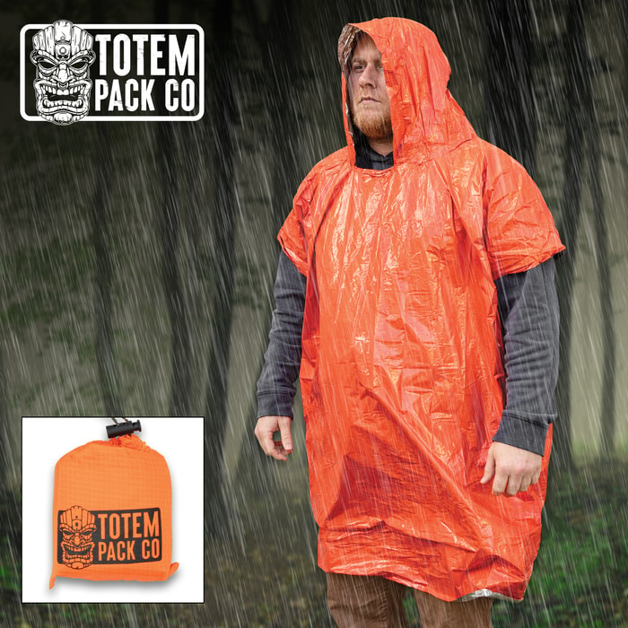 Full image of the orange Totem Pack Co. Camping Rain Poncho being worn by a person.